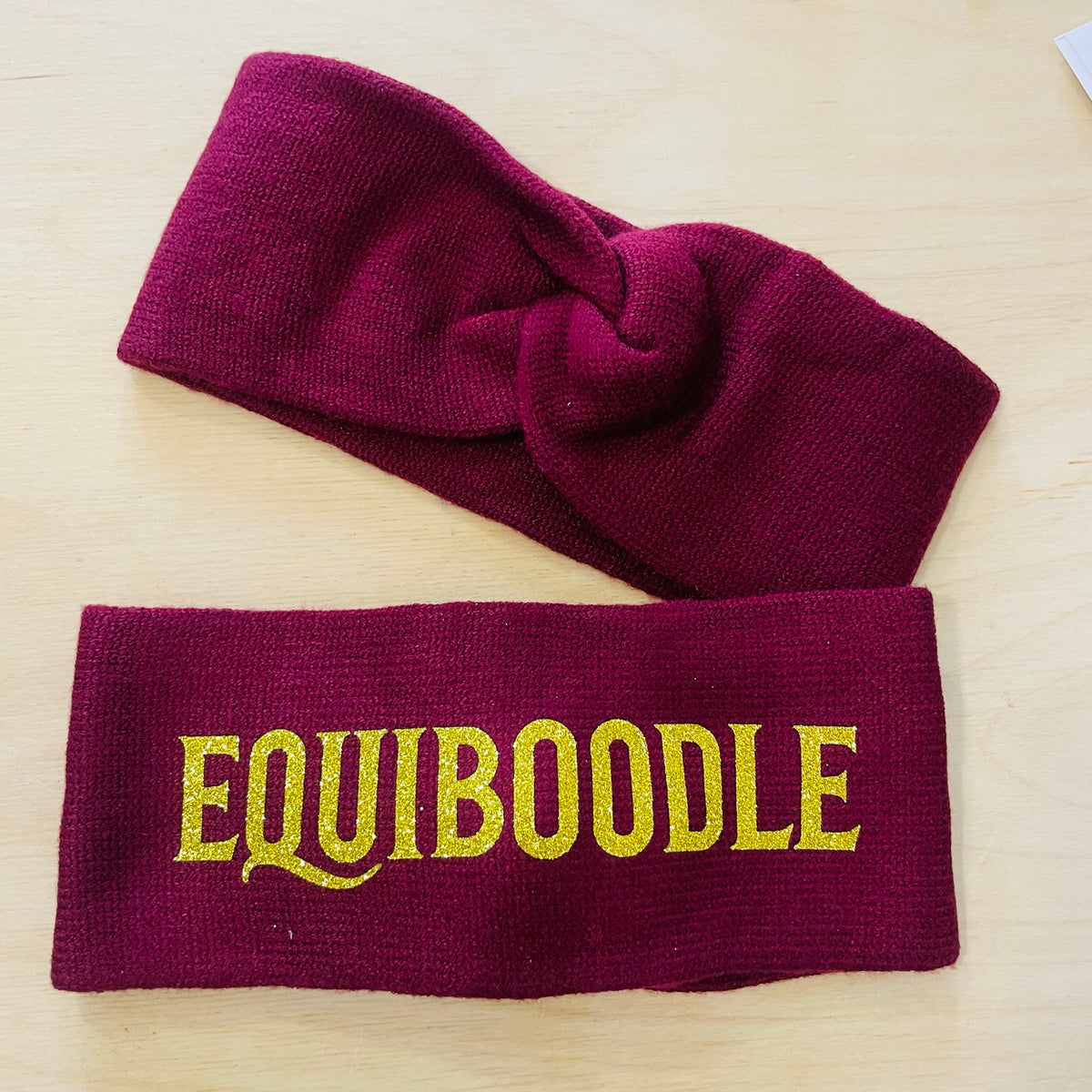 Equiboodle burgundy knitted headband with gold sparkle logo