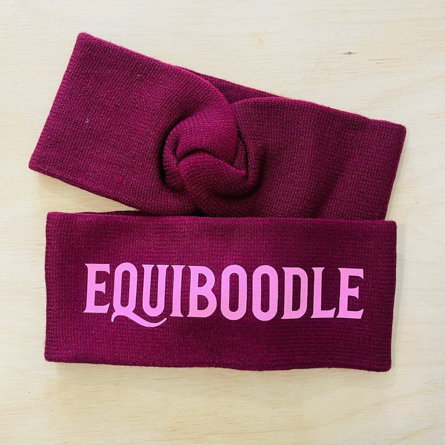 Equiboodle burgundy knitted headband with light pink logo