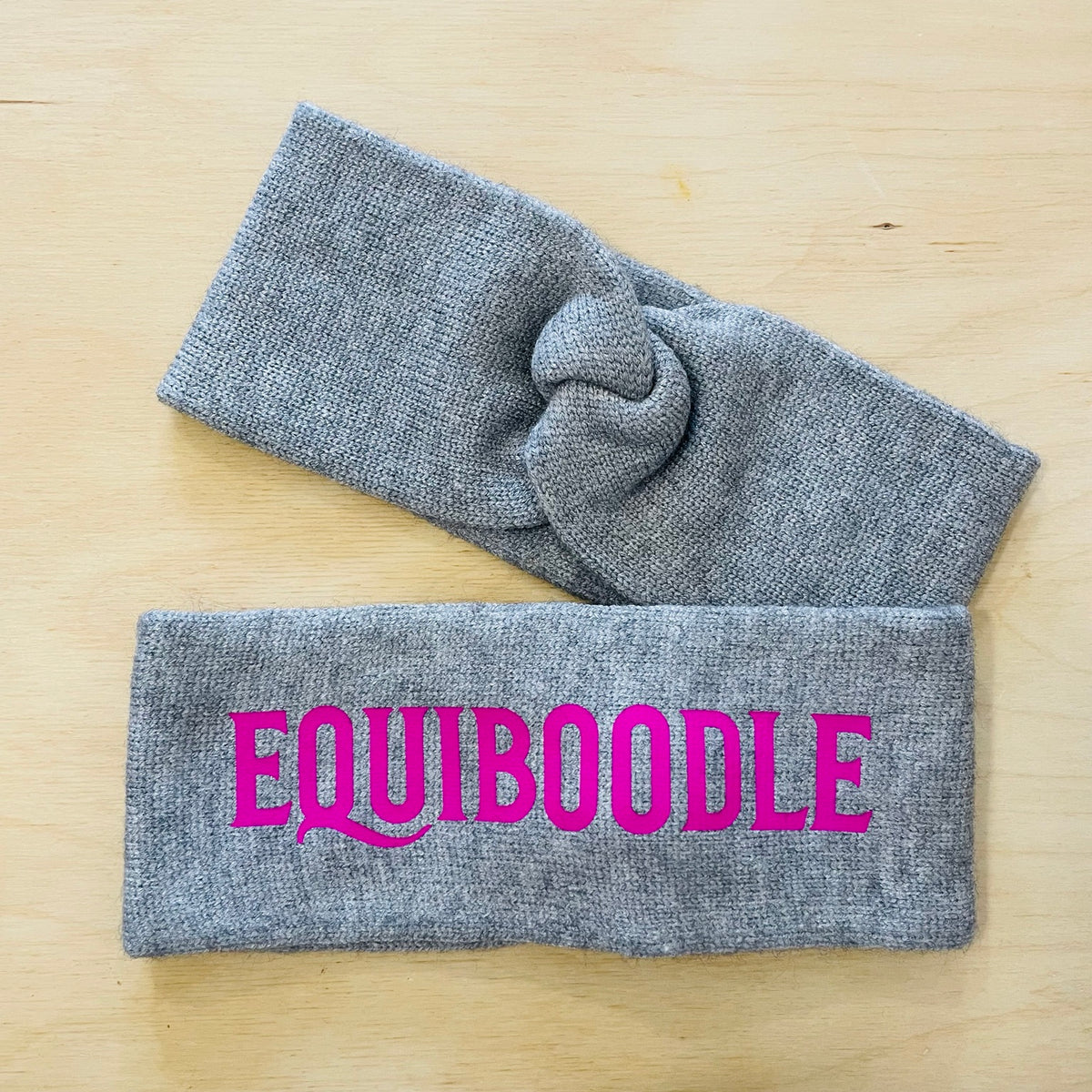Equiboodle grey knitted headband with neon pink logo