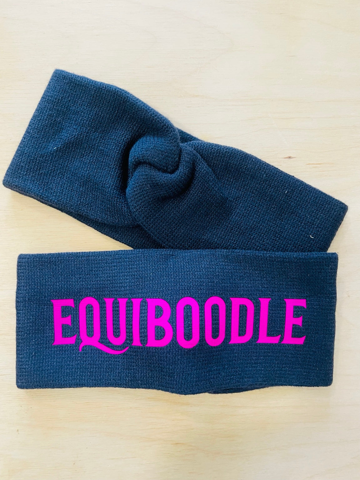 Equiboodle navy knitted headband with neon pink logo