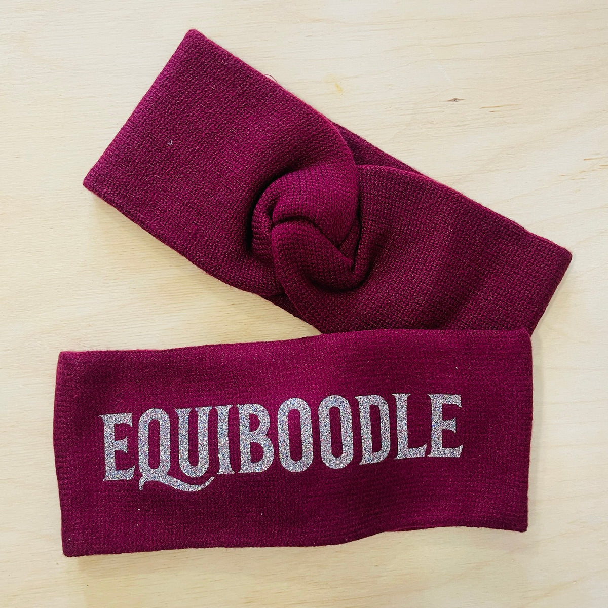 Equiboodle burgundy knitted headband with multi sparkle logo