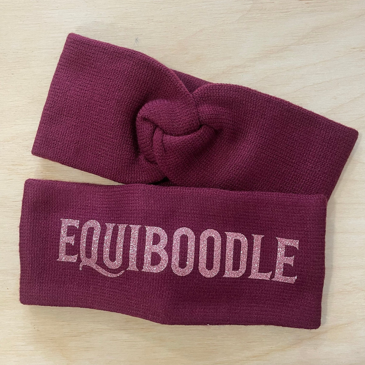 Equiboodle burgundy knitted headband with rose pink sparkle logo