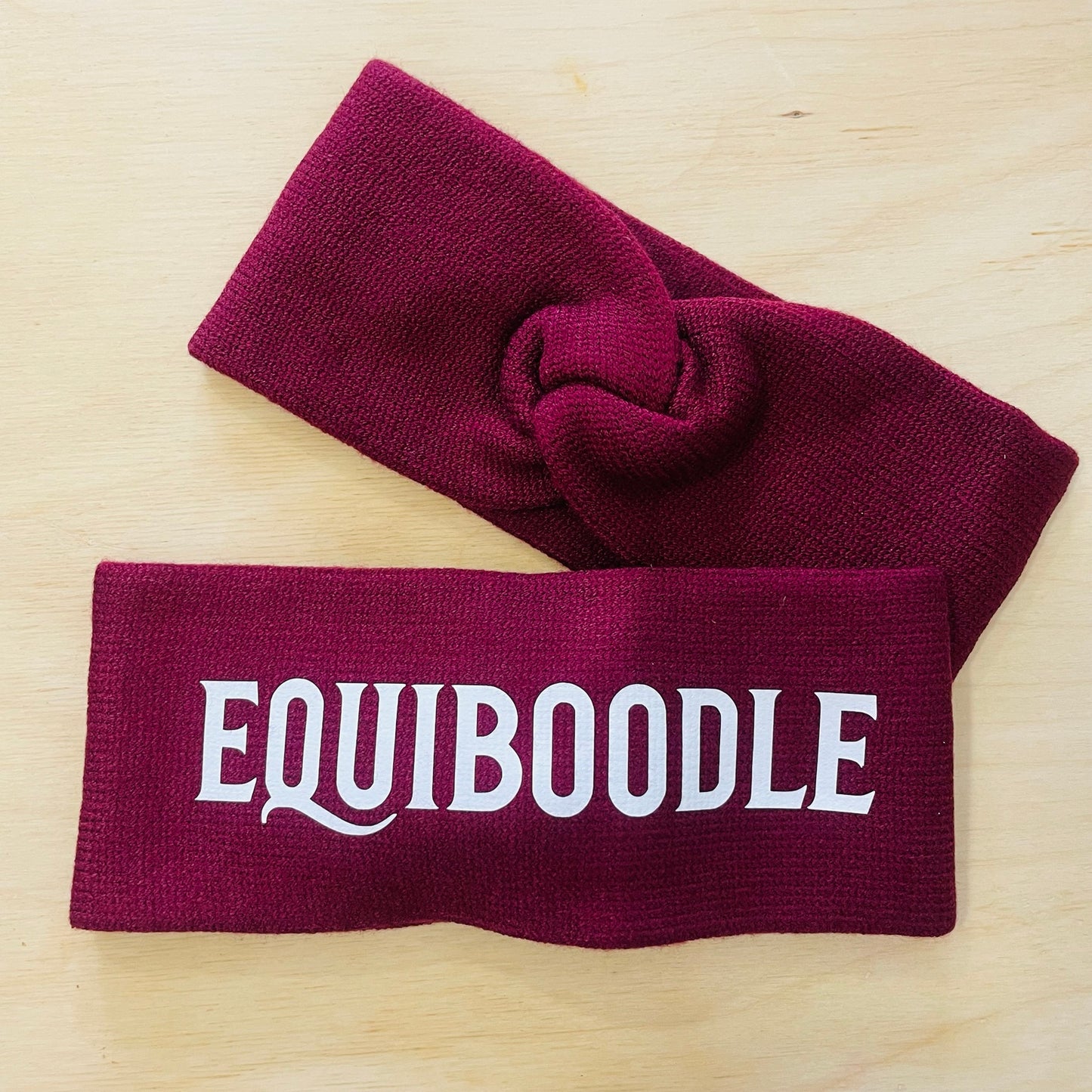 Equiboodle burgundy knitted headband with white logo