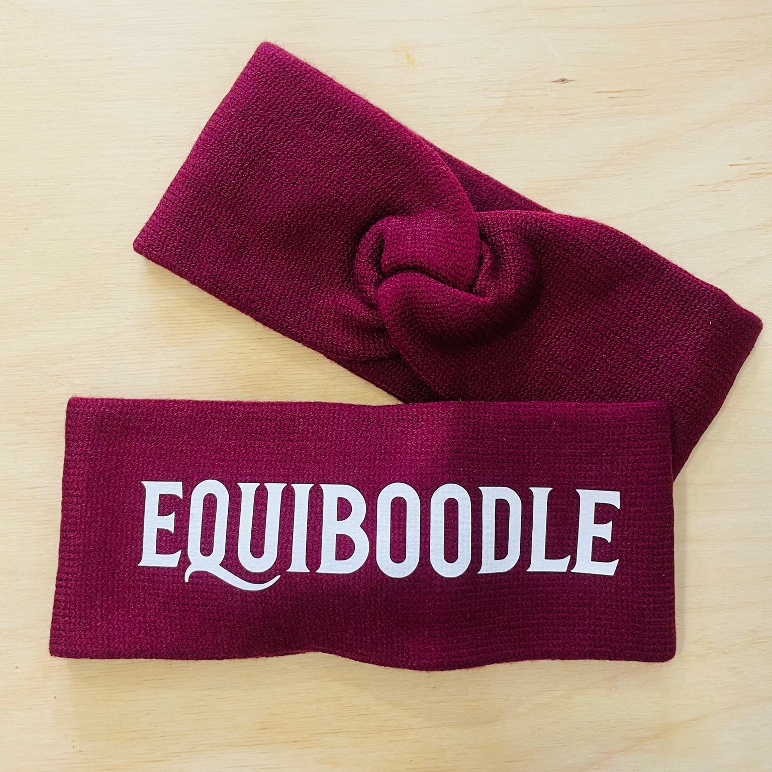 Equiboodle burgundy knitted headband with white logo