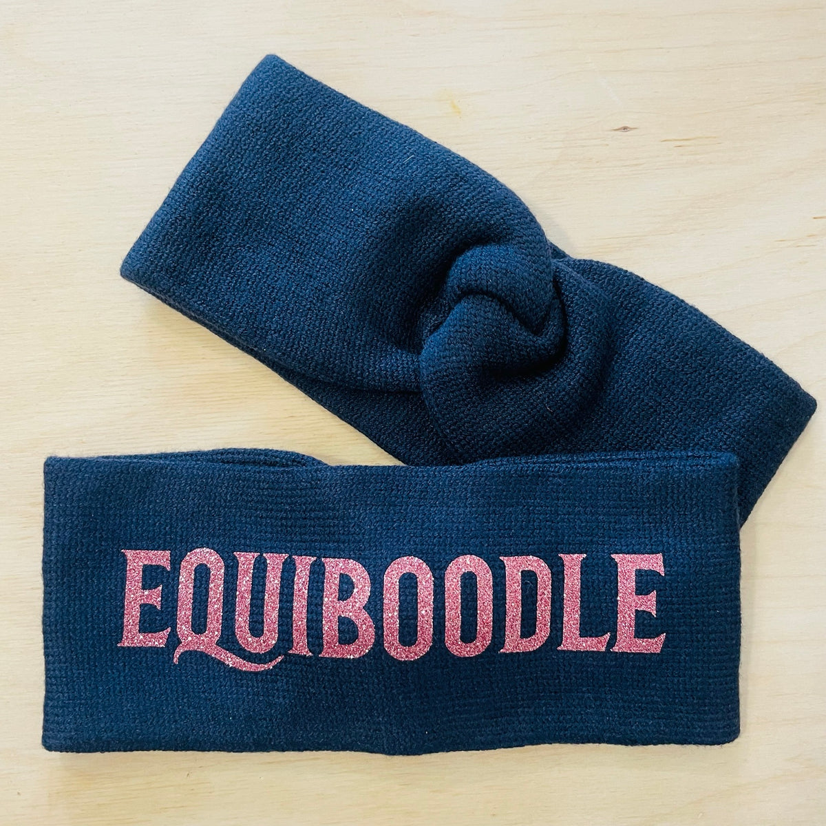Equiboodle navy knitted headband with rose gold sparkle logo