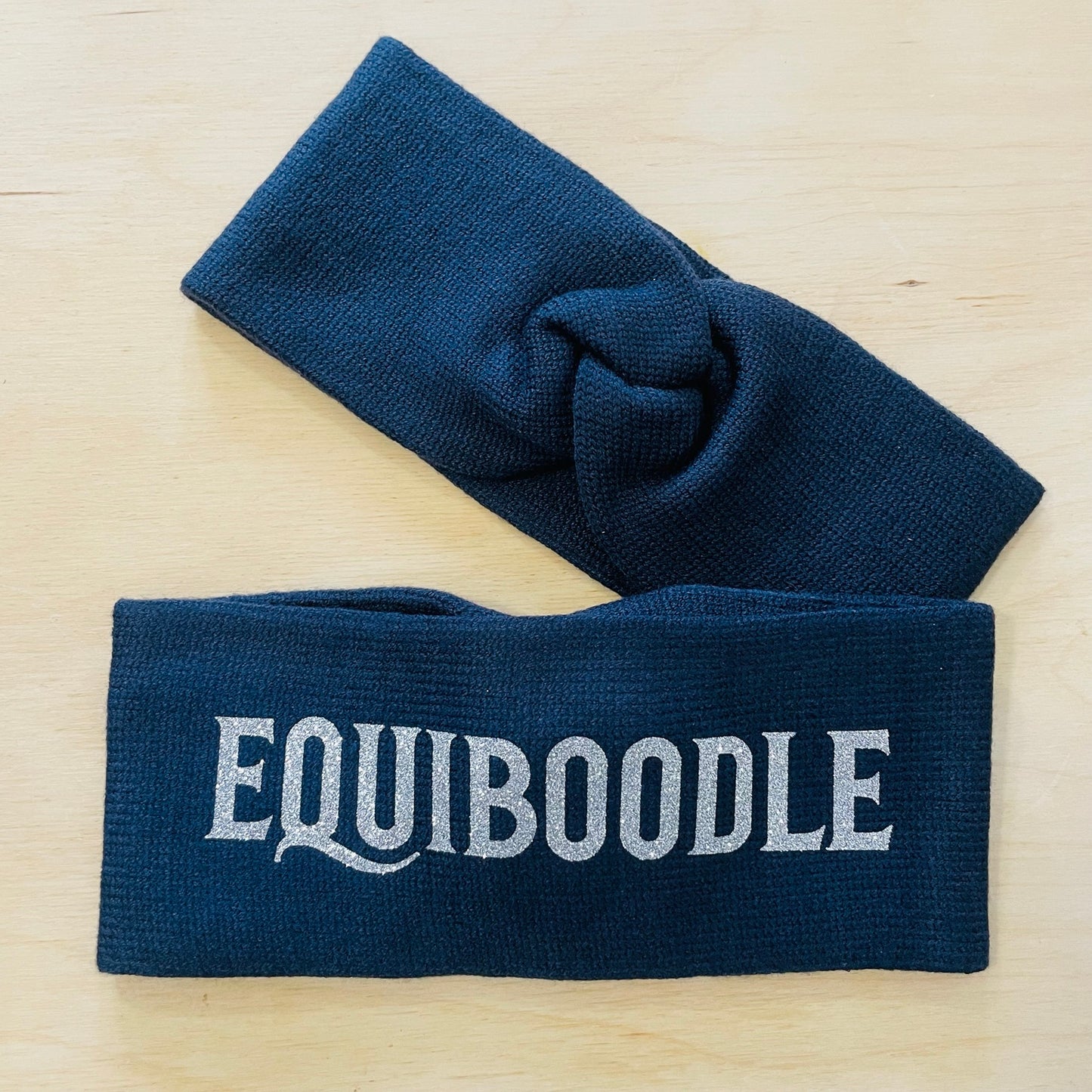 Equiboodle navy knitted headband with silver sparkle logo